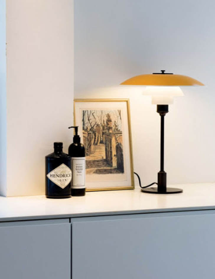 yellow home interiors yellow table lamp by Louis Poulsen